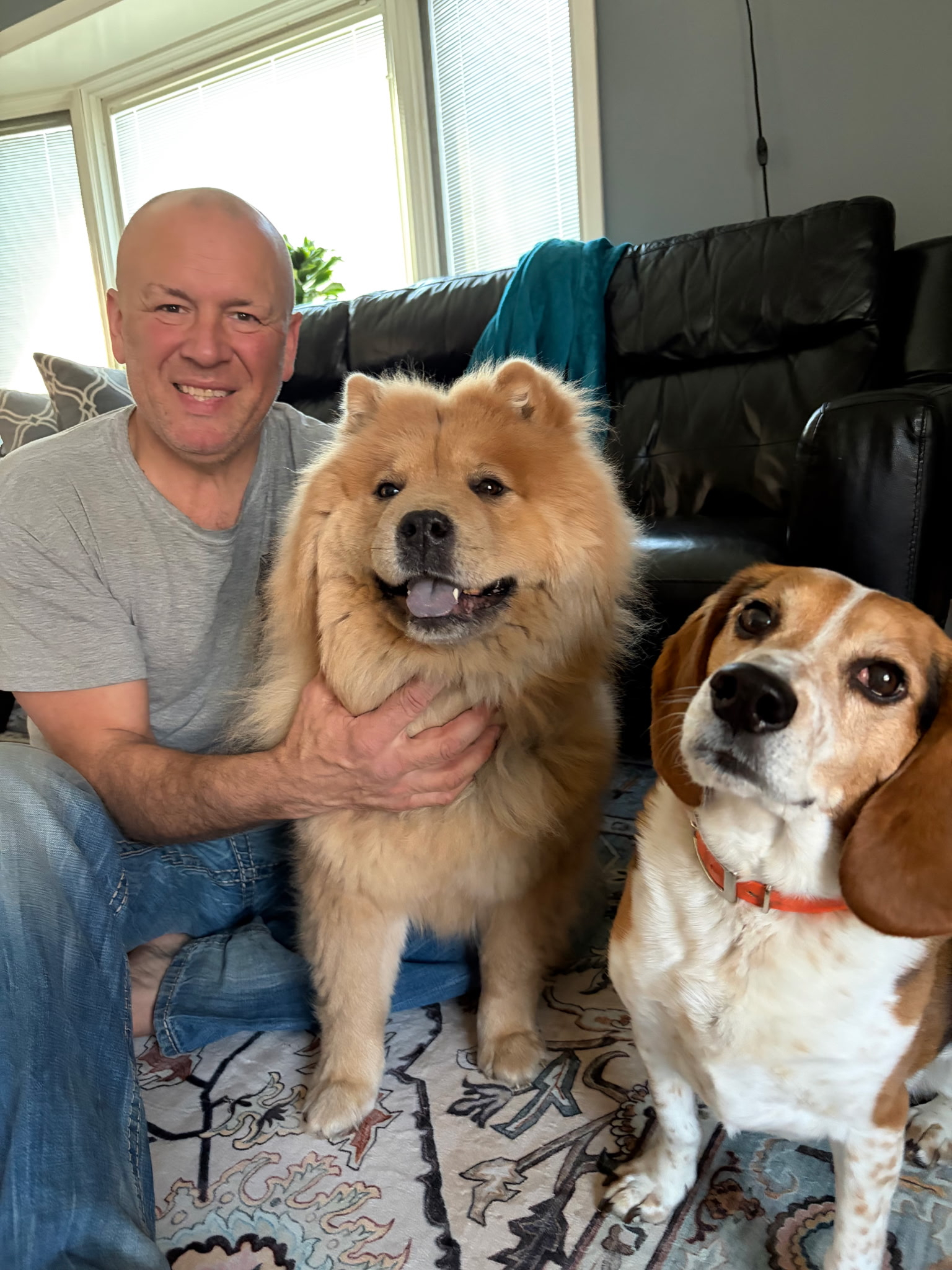 Jeremy Pings at home with his dogs